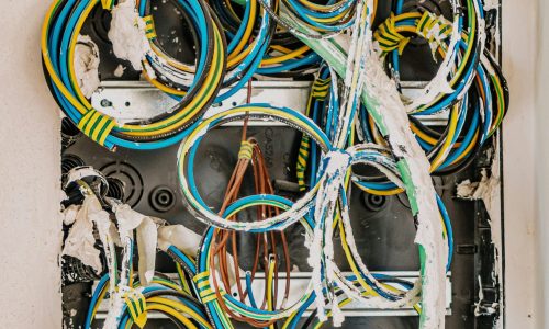Electrical wiring with multicoloured cables and insulation, illustrating complex electrical systems relevant to electrical rewiring and safety upgrades.